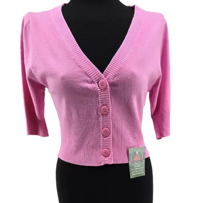 Front view of vintage ladies knitwear cropped pink cardigan with buttons and 3/4 sleeves