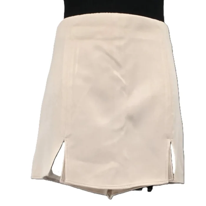 Front view of vintage ZARA beige shorts with skirt overlay and side slits