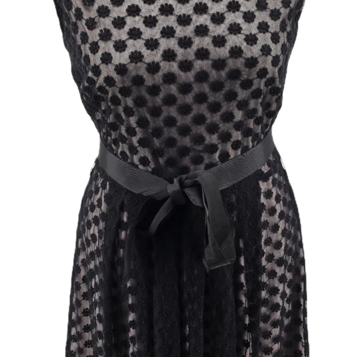 Front view of vintage dress Malvin with black lace overlay and waist tie