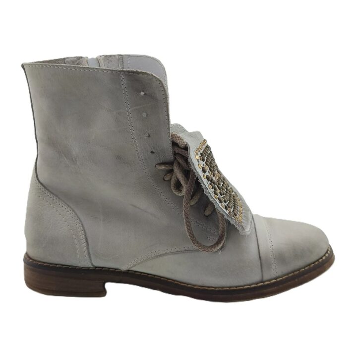 Grey leather vintage boots with decorative metal studs and cotton laces