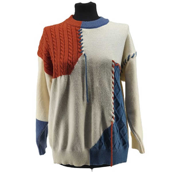 ALT: Front view of colorful patchwork vintage sweater with blue, rust and cream panels.